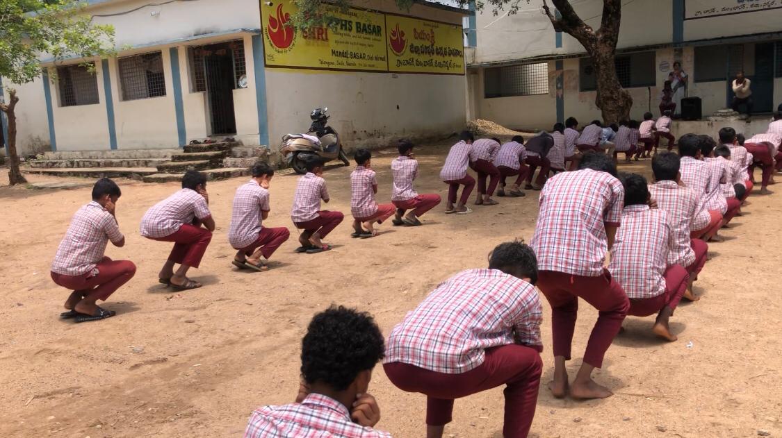 Students performing Super Brain Yoga at ZPHS, Basar, Nirmal Dist.
