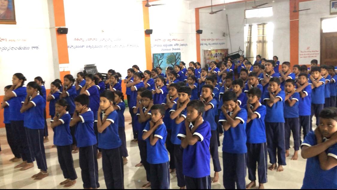 Students performing "Super Brain Yoga"