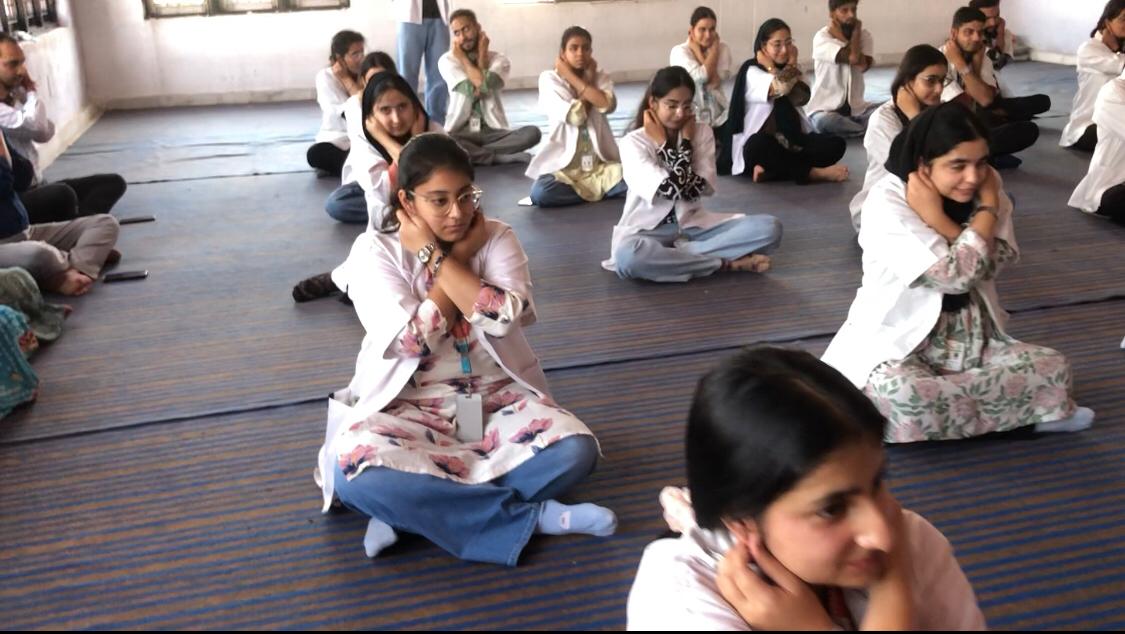Positioning of fingers on earlobes - Workshop on "AI-Powered Super Brain Yoga" at Jammu Institute of Ayurveda & Research, Nardini (Raipur), JAMMU, J & K state.
