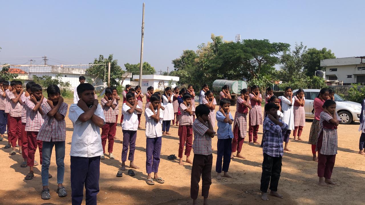 Students performing Super Brain Yoga at Zilla Parishad High School, Mentrazpally, Nizamabad Dist.