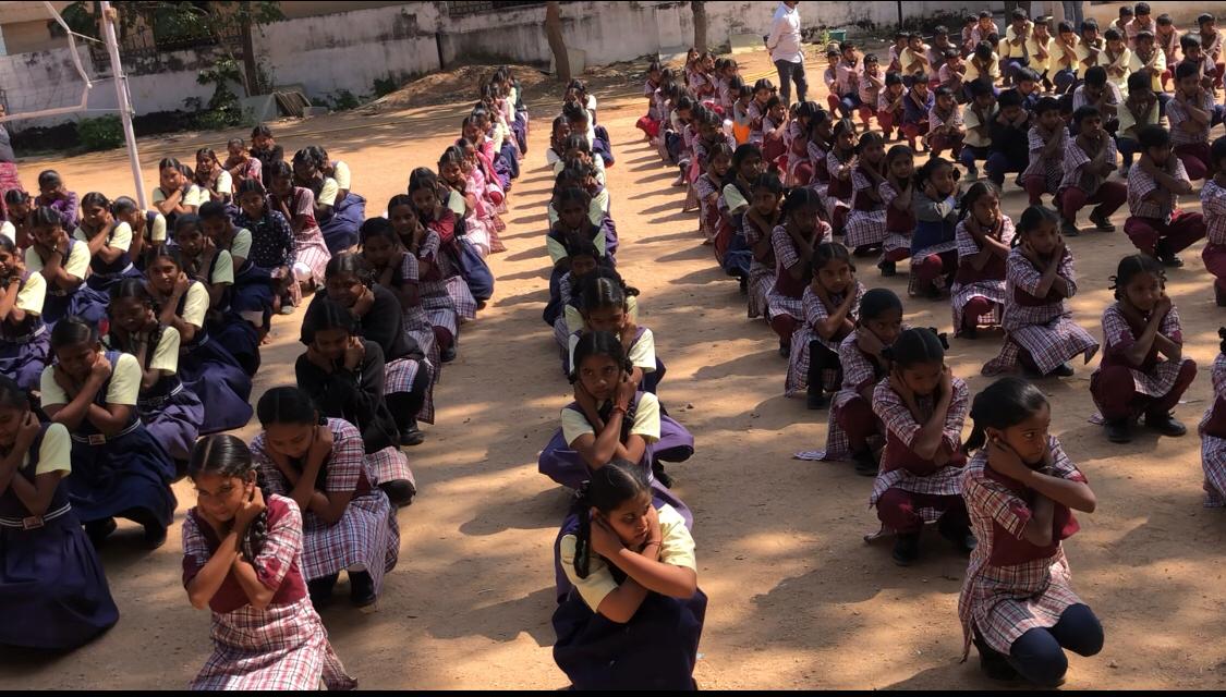 Students performing Super Brain Yoga - Workshop on "Super Brain Yoga" at Zilla Parishad High School, Aloor, Nizamabad Dist.