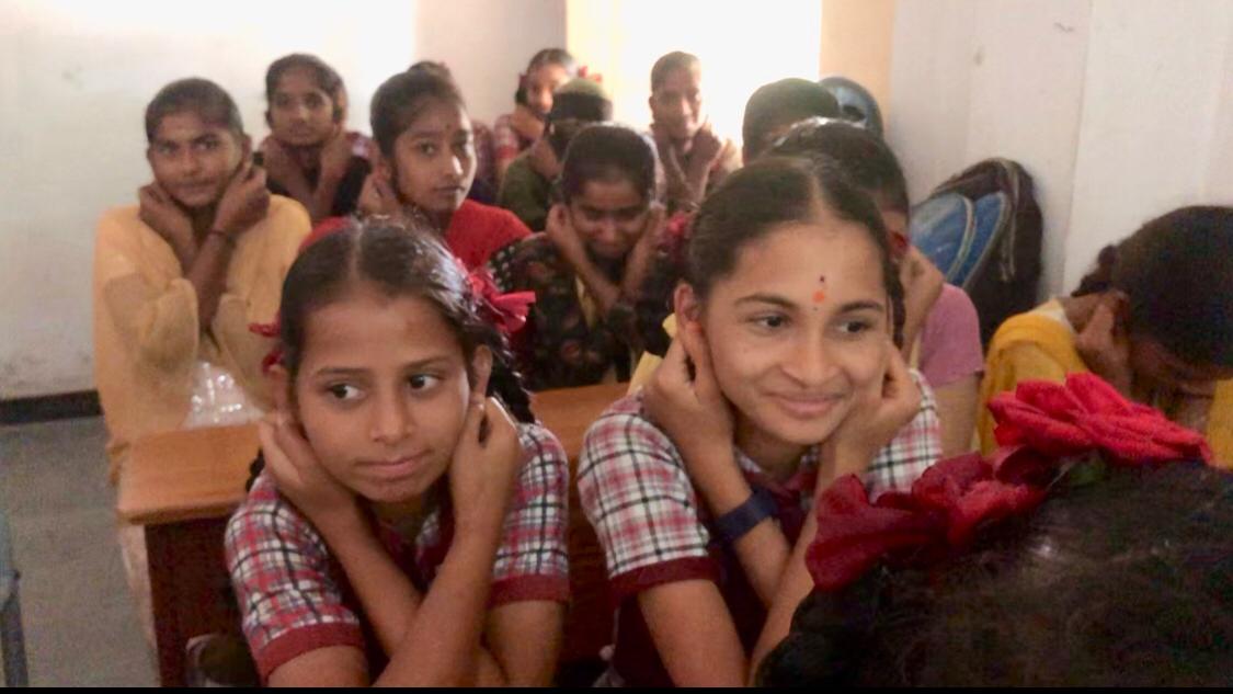 Positioning of fingers on earlobes- Workshop on Super Brain Yoga at Govt. Junior College, Srirangapur, Wanaparthi Dist.