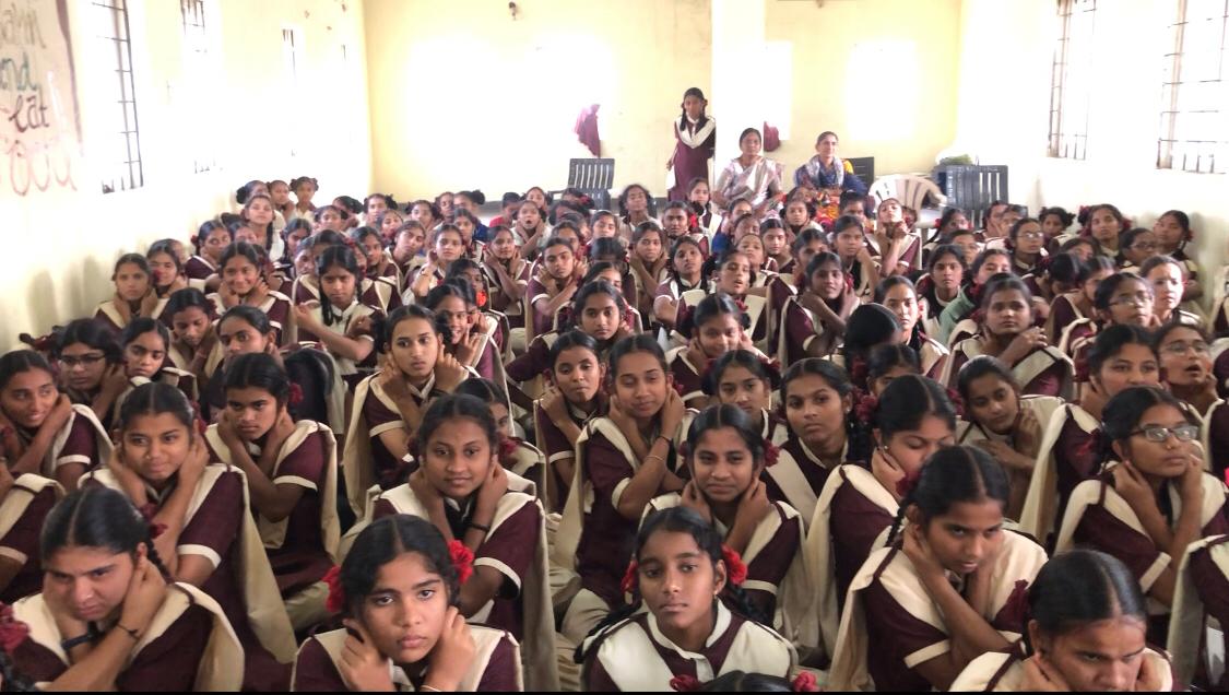 Positioning of fingers on earlobes-Workshop on Super Brain Yoga at Telangana Tribal Welfare Residential Junior College for Girls, Tirmanpally, Indalwai Mandal, Nizamabad Dist.