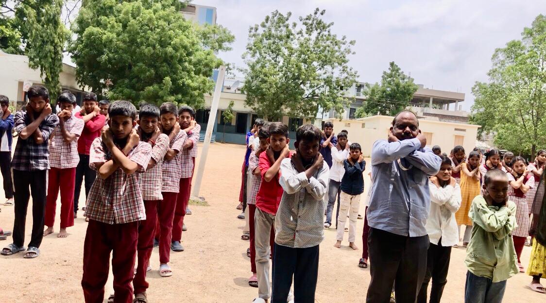 Positioning of fingers on earlobes - Super Brain Yoga Workshop at Govt. High School, Kotagalli, Shankar Bhavan, Nizamabad sponsored by Lions International, Nizamabad-Netha, Club No. 155665, Dist: 320 D.