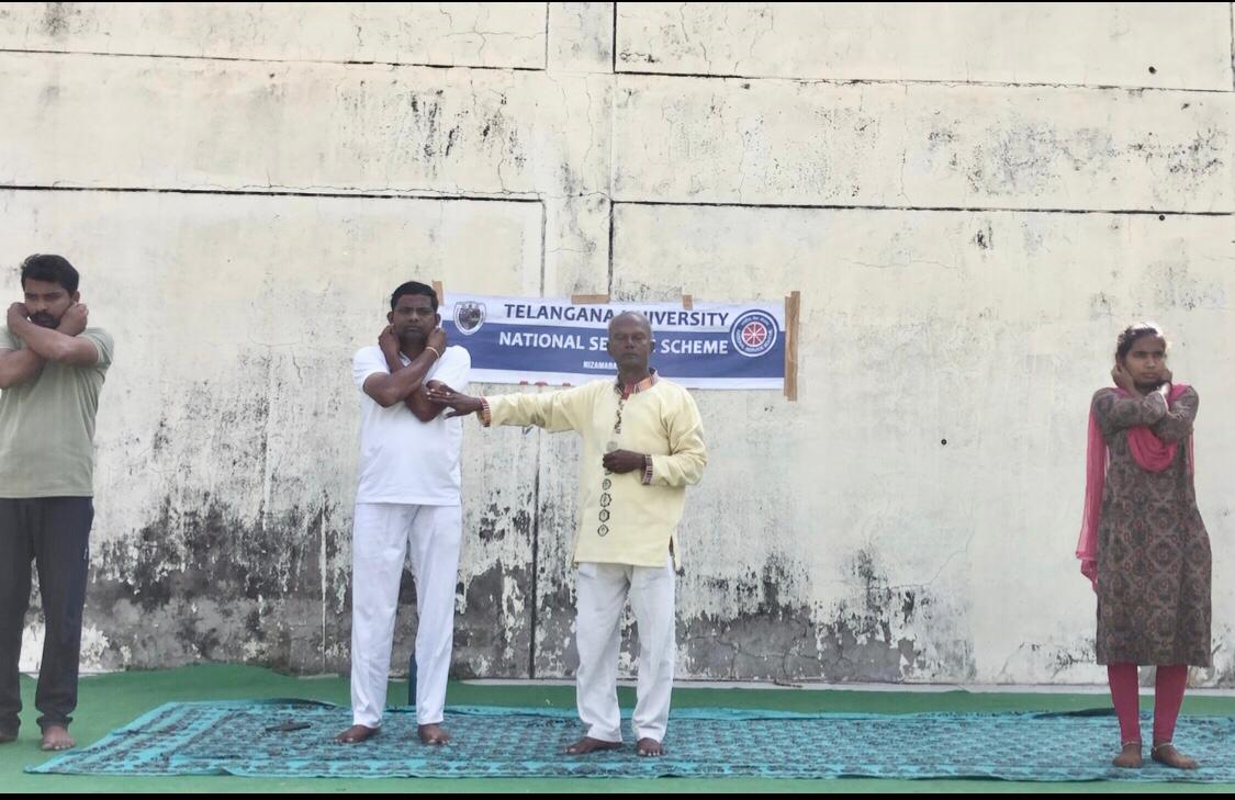 Positioning of Fingers on Earlobes-Workshop on Super Brain Yoga at Telangana University organized by NSS Cell on the occasion of 12th International Day of Yoga.