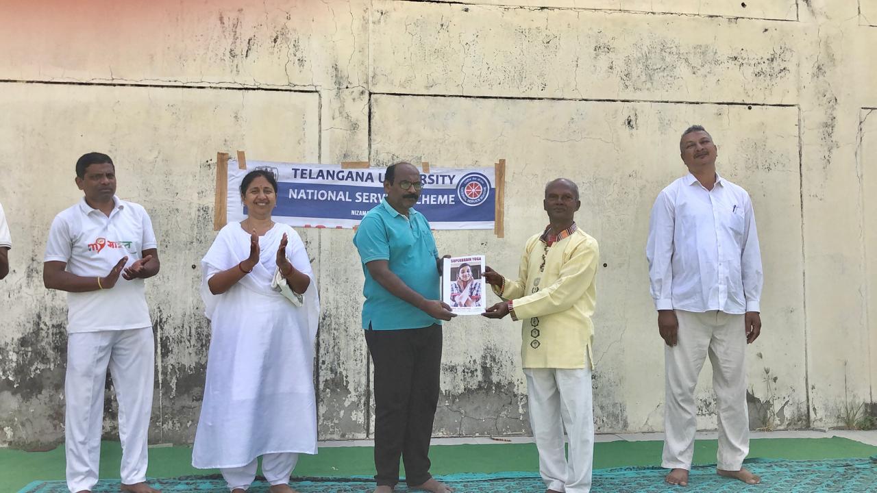 Presented copy of article published on Super Brain Yoga to Principal, Telangana University organized by NSS Cell on the occasion of 12th International Day of Yoga.