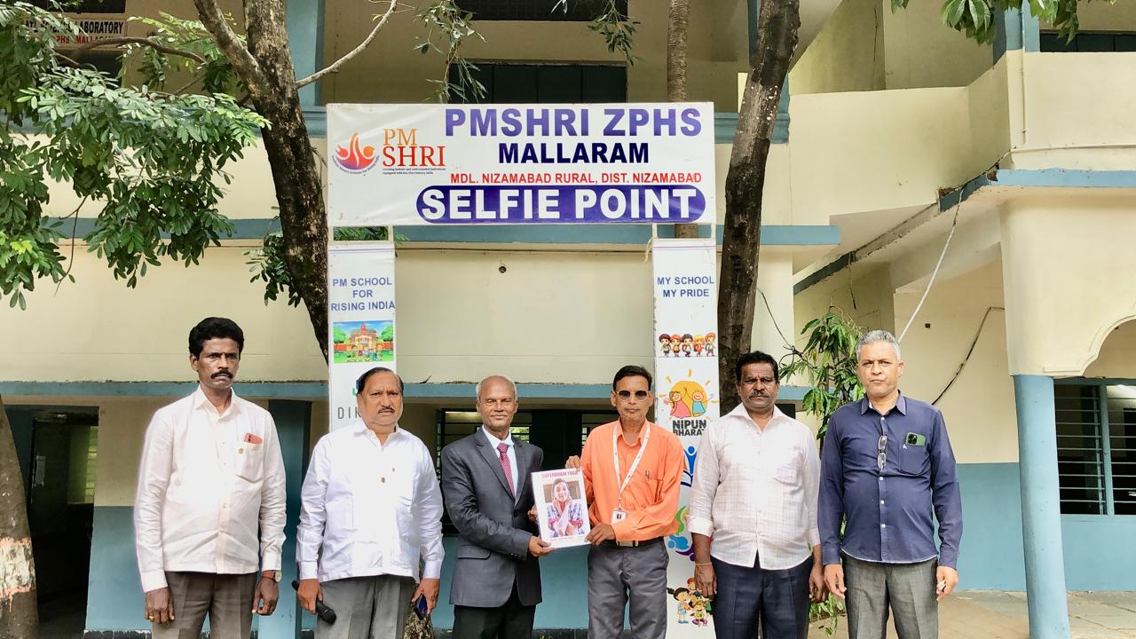 Copy of article on Super Brain Yoga published in SCERT Compendium was presented to Head Master Sri. Ram Mohan - Workshop on  Super Brain Yoga at P.M. Sri Zilla Parishad High School, MALLARAM, Nizamabad Mandal & District.