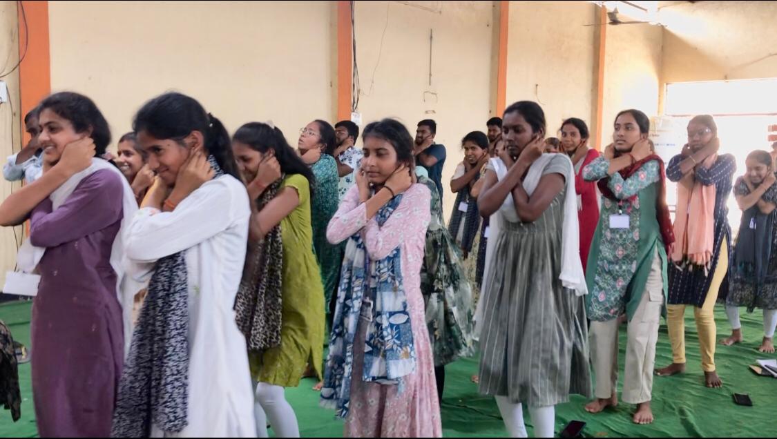 Positioning of fingers during performing Super Brain Yoga as part of workshop at Summer Special Camp, National Service Scheme Unit-II, Telangana University organized at Dichpally village on 26-04-2026.