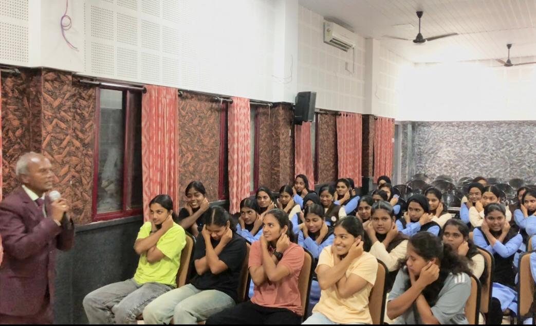 Positioning of fingers on earlobes during Super Brain Yoga at MES Ponnani College, Ponnani, Kerala state. organized by Sattava Yoga & Meditation Club, Dept. of Physical Education & Legacy Wisdom Circle, Center for IKS.