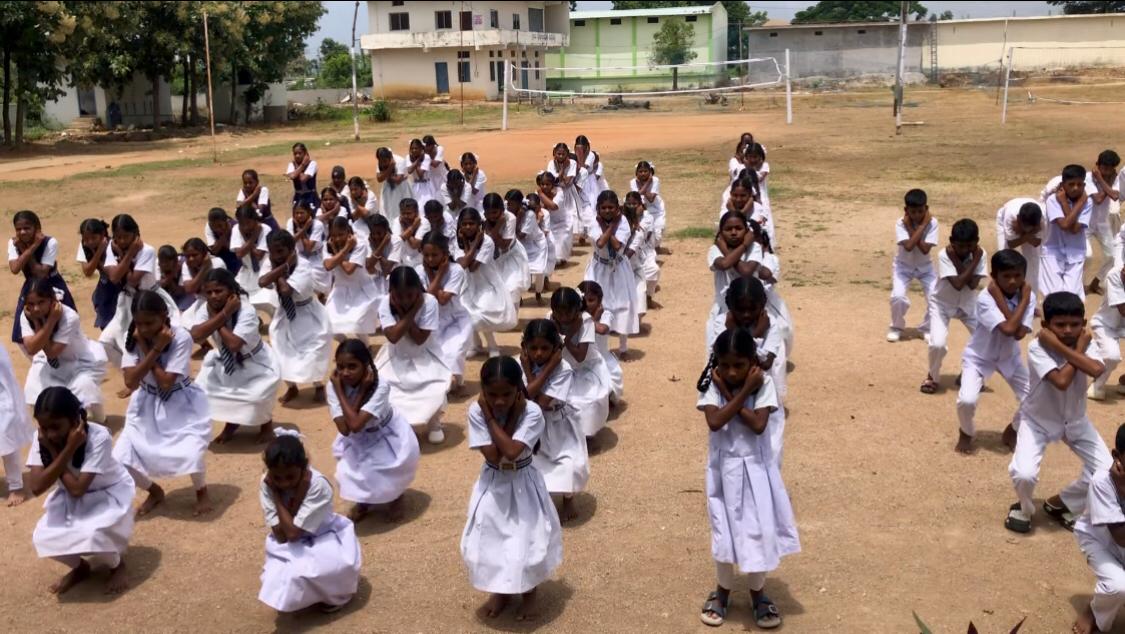 Students performing Super Brain Yoga- Workshop on Super Brain Yoga at Zilla Parishad High School, Suddapally, Dichpally Mandal, Nizamabad Dist. The program was sponsored by International Lions Club of Nizamabad-Netha.
